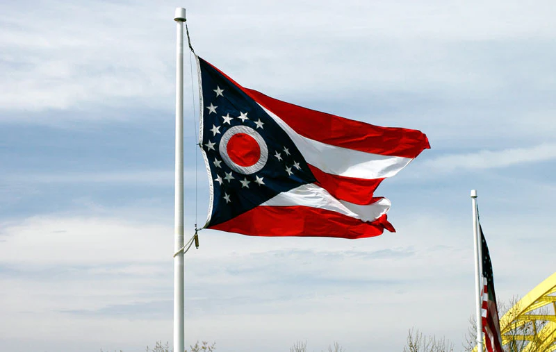 The Ohio state burgee flag flying against a blue sky